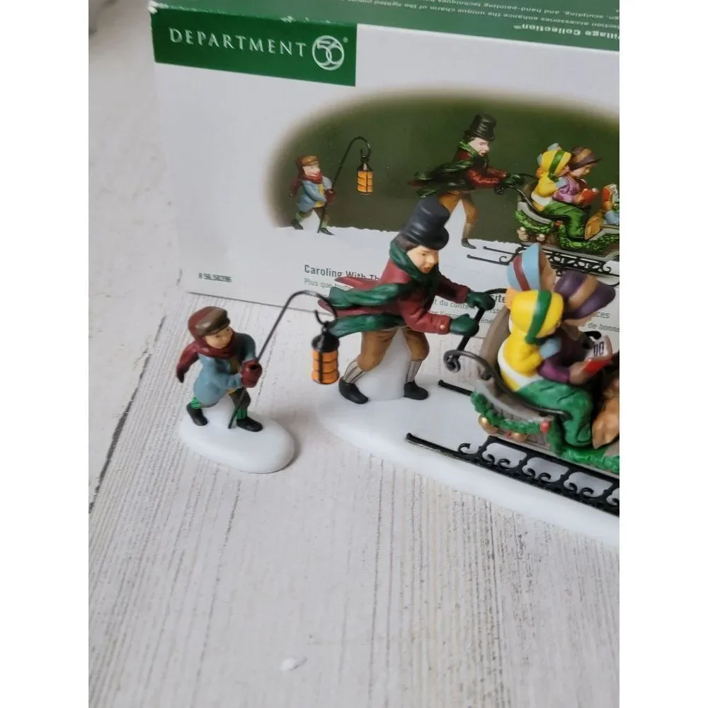 Dept 56 58396 Caroling With The Cratchit Family (Revisited) village accessory xm